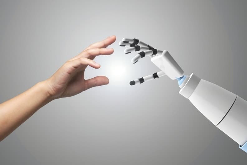 A human hand and a robotic hand reaching toward each other, symbolizing the contrast between personalized financial advice from a human advisor and AI-driven financial tools.